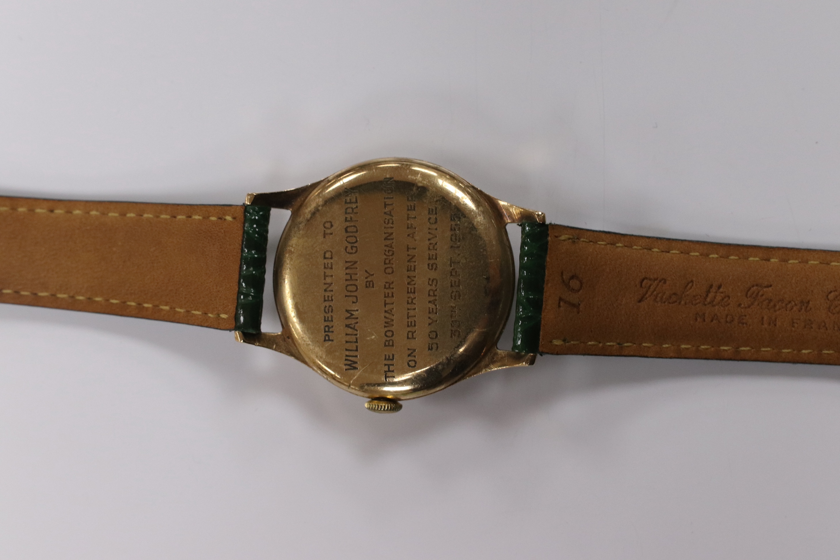 A gentleman's 1950's 9ct gold Movado manual wind wrist watch, with Arabic dial, subsidiary seconds and case back inscription, case diameter 31mm, on a later associated leather strap. Condition - fair